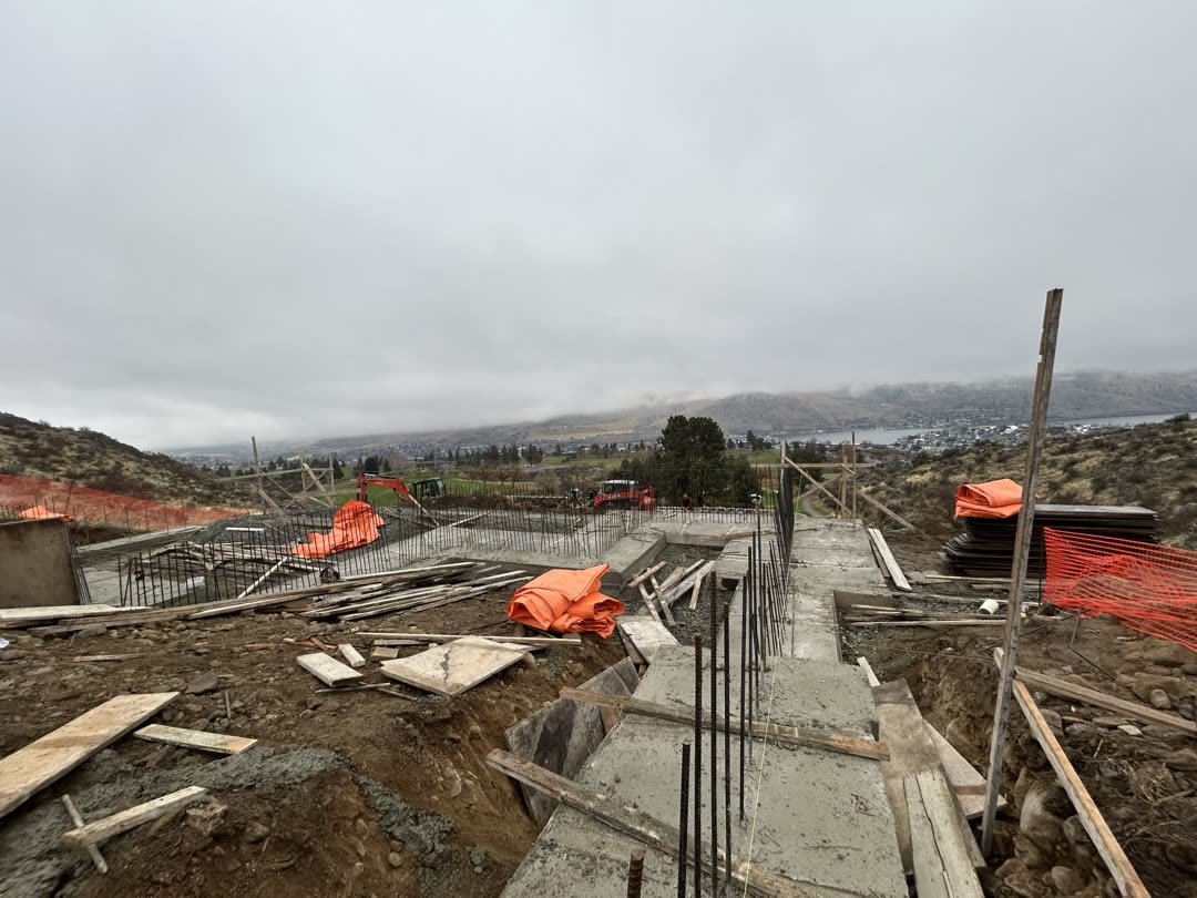 Stepped concrete foundation walls looking out over Lake Chelan