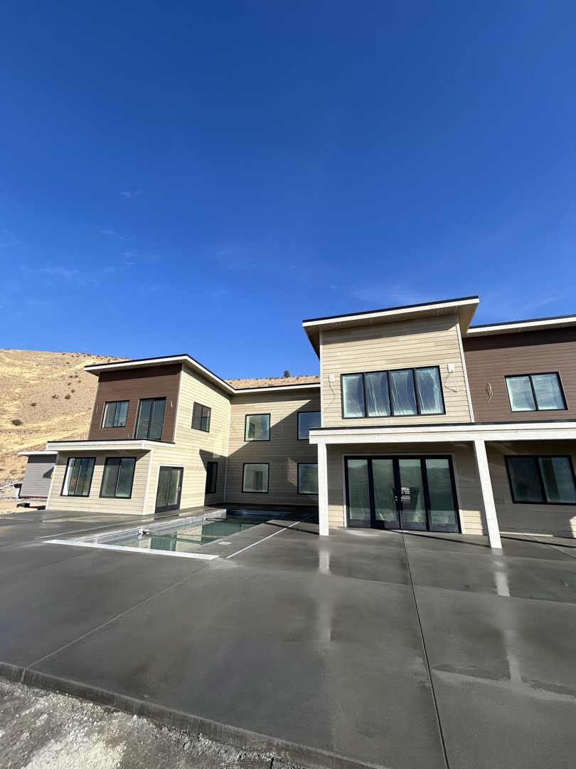 Finished concrete patio and walkways at a completed Chelan County home